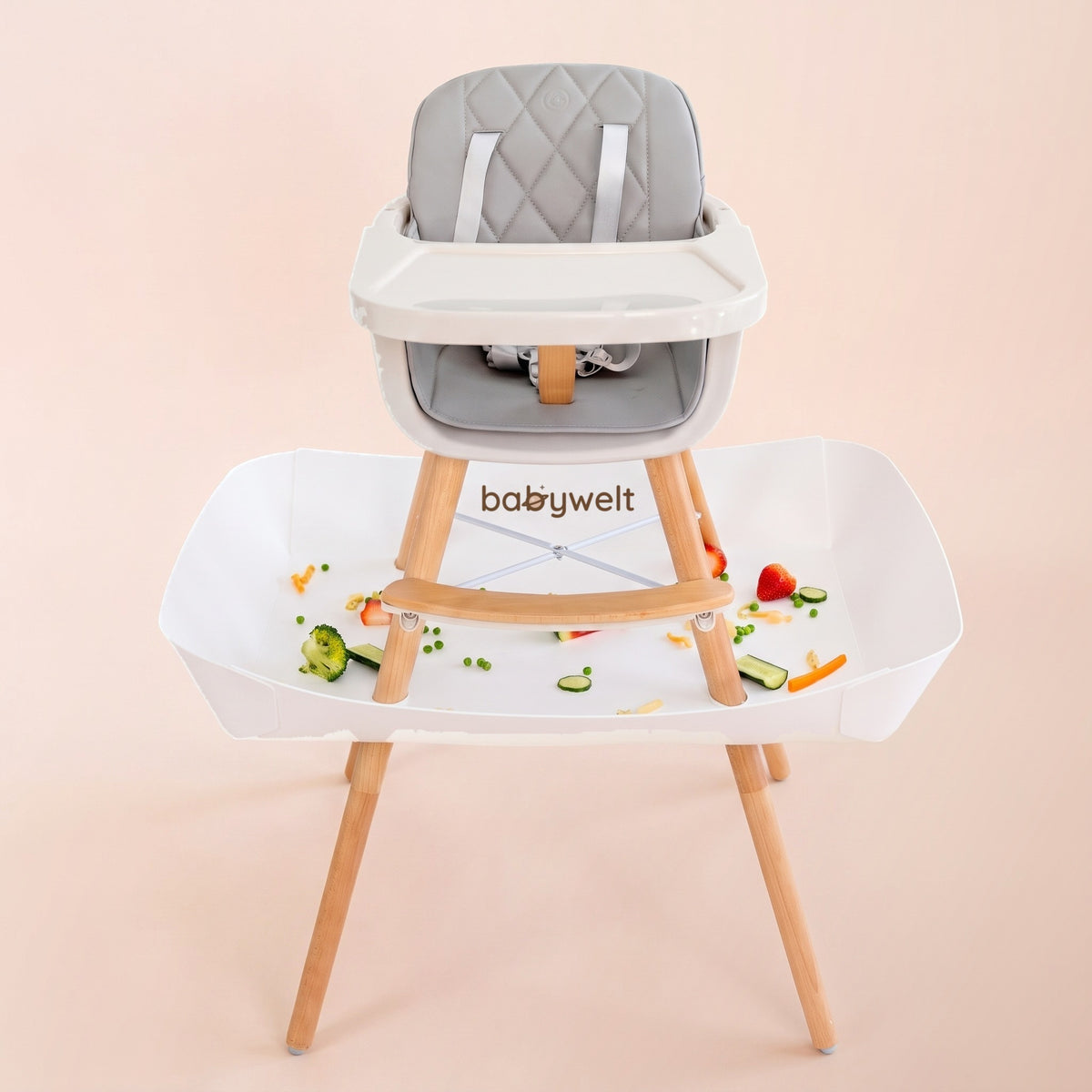 Raccogli-pappa per seggiolone bianco sotto un seggiolone imbottito grigio